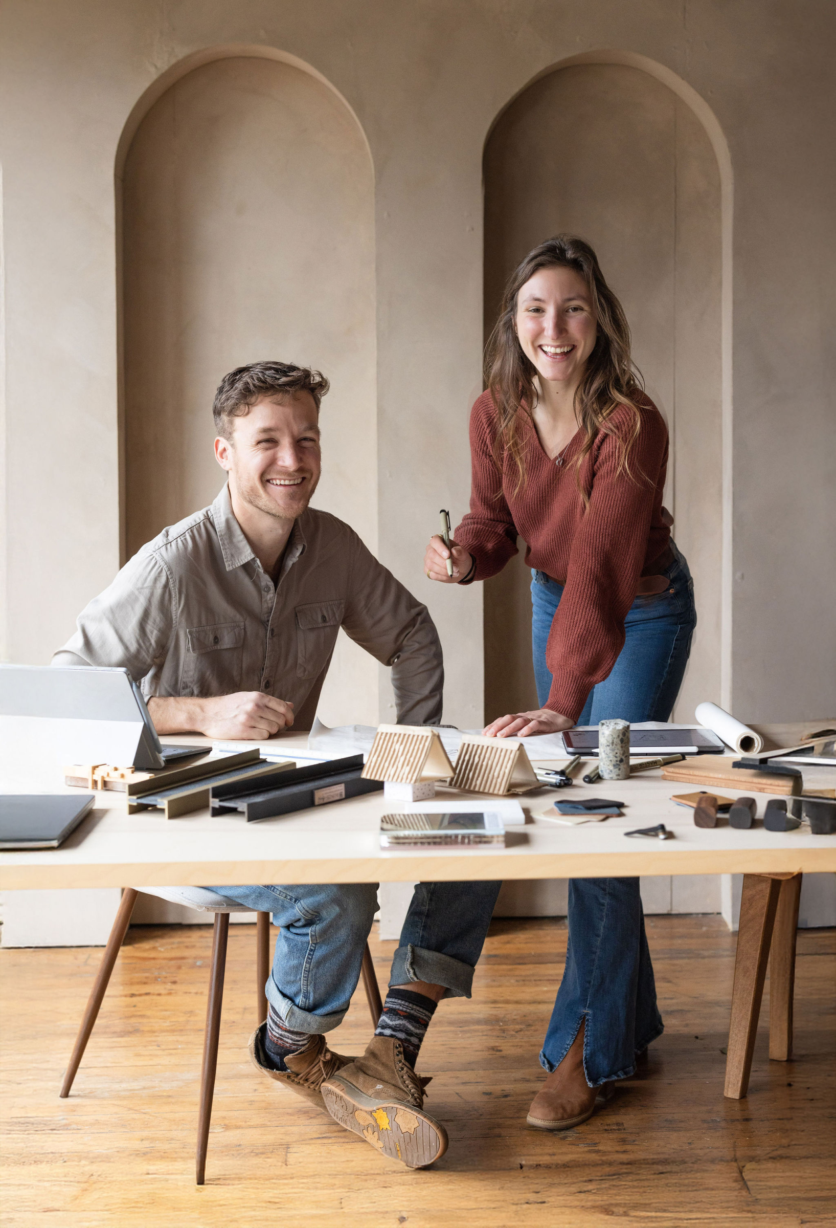 Portrait of Julia and Stone, principals of Refine Design Architecture, photographed indoors in a natural, understated setting that reflects their collaborative residential practice focused on site-conscious, concept-driven design and thoughtful architectural work.